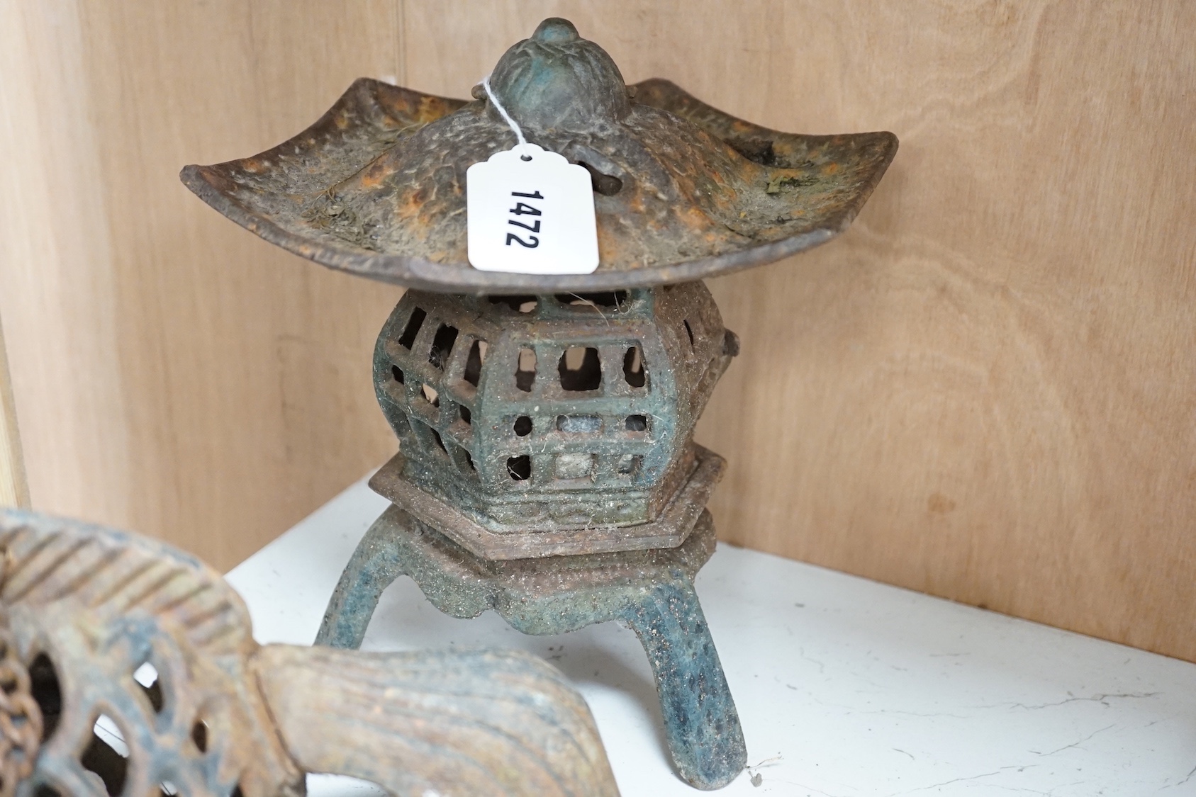 A Japanese iron lantern and two similar koi